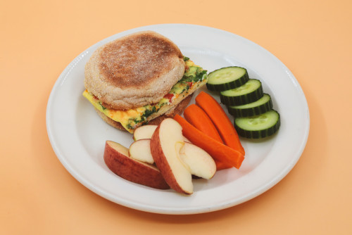  Egg omelet with vegetables and cheese, on a whole wheat English muffin, served with warm cinnamon apples. 